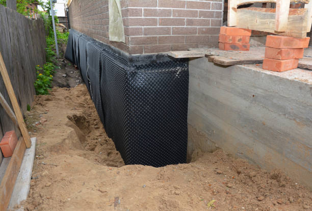 SJ Waterproofing Pros technician performing targeted Basement Waterproofing assessment in Plainfield, NJ
